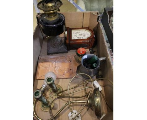A pewter mug, mantel clock, a pair of brass candlesticks, brass lamp, part oil lamp, etc.