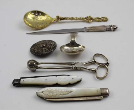 An Alexander Ritchie (1856-1941) silver Iona brooch of Celtic form (pin missing), 4cm in diameter, a silver caddy spoon with 