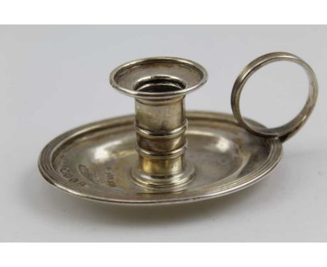 Charles Rawlings, A George IV silver small chamber or taper stick holder, oval base with ring handle, London 1824, the base, 