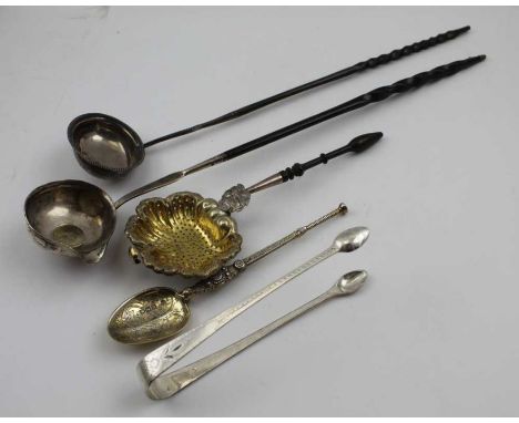 Edward Barnard &amp; Sons Ltd. An Edwardian silver gilt anointing spoon, a pair of Georgian silver sugar tongs, with bright c