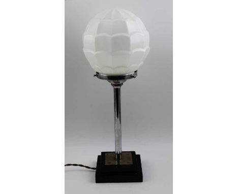 An Art Deco table lamp, chrome stem on an ebonised base, fitted a white opaline shade, overall 46cm high