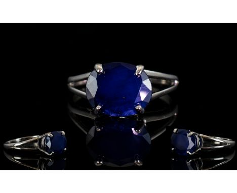 Blue Sapphire Solitaire Ring, 6.25cts of rich blue sapphire in a single oval cut stone, set east/west across the finger, in a