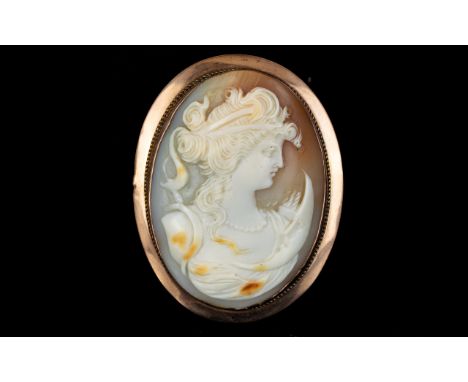 Antique Period Large Nice Quality Oval Shaped Shell Cameo Within a 9ct Gold Pendant / Brooch, Depicts a Young Lady Wearing a 