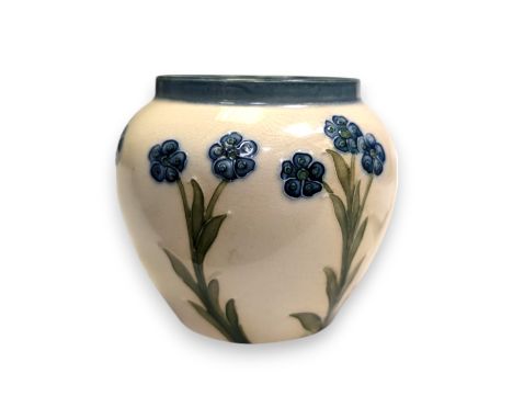 A William Moorcroft for Macintyre & Co Florian ware jar, circa 1905, of squat baluster form, with a blue banded rim over a pa