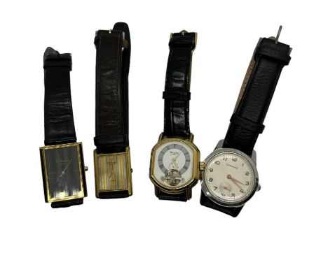 A collection of four gentlemen&rsquo;s dress watches to include a Garrard manual wind wristwatch. Also comprising a Woodford 