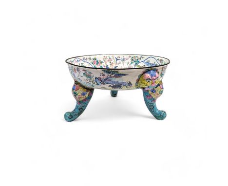 An unusual 19th century Canton enamel tripod bowl, the interior decorated with a circular central cartouche depicting figures