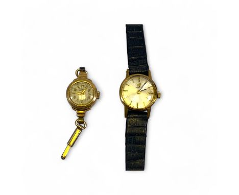 A Ladies 9ct yellow gold manual wind watch head on leather strap 19mm case and another 9ct yellow gold watch head, total weig