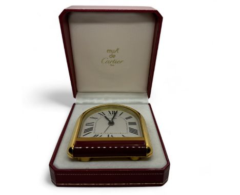 A 1990s Must de Cartier easel backed travel alarm clock with quartz movement and presentation engraving. With tooled presenta