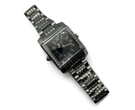 A Rotary Revelation day and night Swiss made revolving wristwatch. Case measuring 22mm x 25mm. Lug width 16mm. In stainless s
