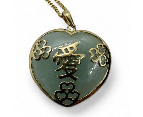 A 9ct yellow gold and jade necklace with Chinese lettering. Heart shaped pendant and 9ct yellow gold chain. Jade untested for