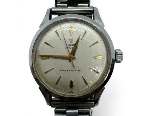 A 1950s Tudor Oyster wristwatch.  Champagne dial with gilded baton markers to a manual wind movement. Case diameter 33mm appr