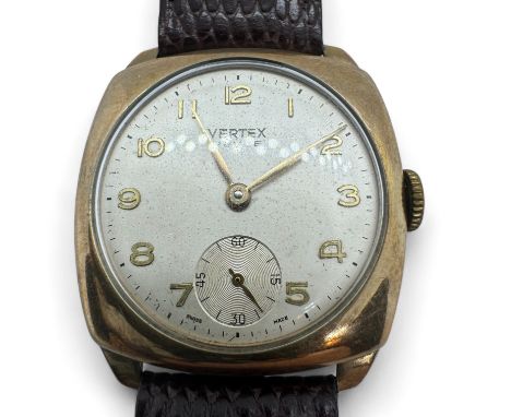 A 9ct gold 1960s Vertex Revue wristwatch. Rounded square case, with circular champagne dial with gilt Roman numerals and seco