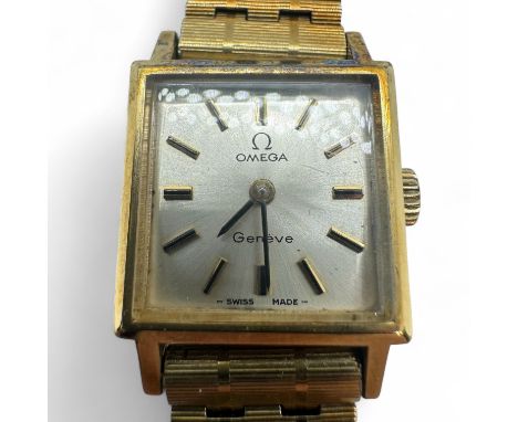 A ladies square case Omega Gen&egrave;ve on a gold plated bracelet. Silvered dial with baton markers to a manual wind movemen