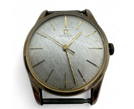 A 1960s 9ct gold Omega gentleman’s manual wind wristwatch.  With brushed champagne dial, with baton markers to a manual wind 