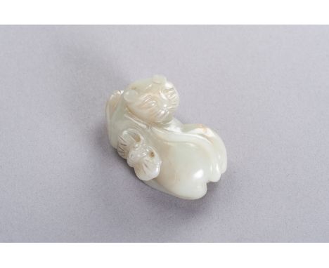 A CELADON JADE 'CAT AND BUTTERFLY' PENDANT, LATE QING TO REPUBLICChina, late Qing dynasty (1644-1912) to Republic period (191