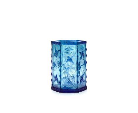 A CARVED HEXAGONAL BLUE OVERLAY GLASS BRUSH POT, QING DYNASTYChina, 1820-1880. Translucent sapphire-blue overlay carved and i