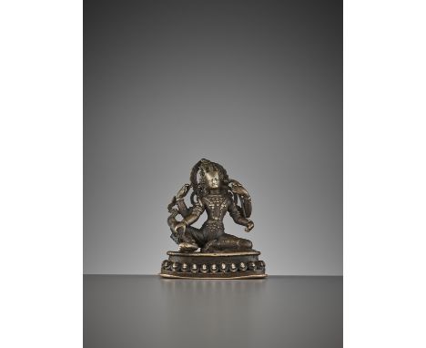 A SMALL BRONZE OF THE FOUR-ARMED AVALOKITESVARA, 15TH-16TH CENTURYNepal. Seated in lalitasana on a lotus base, the main right