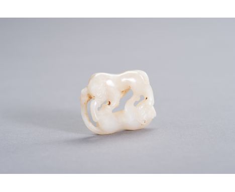 A WHITE JADE DOUBLE CAT CARVINGChina, Qing Dynasty (1644 - 1912). The white jade double cat carving, either to be worn as a p