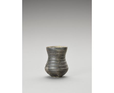 BLACK GANDHARAN VESSELGandhara region, c. 3rd BC-2nd cent. Black burnished ceramic narrow-waisted vessel (possibly a jug) on 