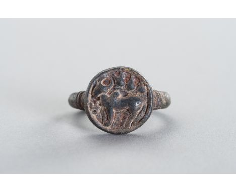 A BRONZE INTAGLIO RING DEPICTING NANDIAncient region of Gandhara, 7th - 8th century. The top with a beautifully worked intagl