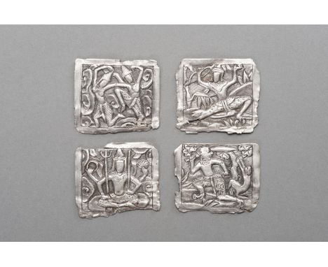 FOUR SILVER REPOUSSE VOTIVE PLAQUESBurma / Myanmar, 18th century or earlier. Of rectangular form, each executed in fine repou