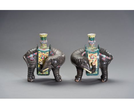 A PAIR OF CAPARISONED ELEPHANT JOSS STICK HOLDERSChina, 1900-1920. Each hand-painted and printed all over, the caparison with