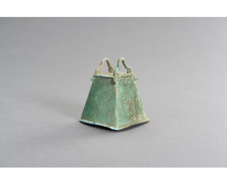 A SMALL BRONZE BELLSouth China/ Northern Vietnam, Dong-Son culture (800 BC - 200 AD). The quadrilateral bell, cast with lobed