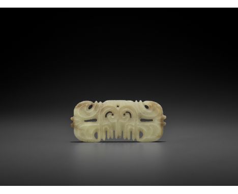 A LIGHT YELLOW JADE 'TOOTHED' ORNAMENT WITH MASK MOTIFJade. China, Hongshan culture, c. 3500-2500 BCAs exemplified by the pre