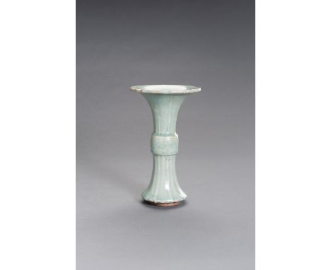 A LONGQUAN CELADON GLAZED CERAMIC GU VASE, MING DYNASTYChina, Ming dynasty (1368-1644). The central bulbous section decorated