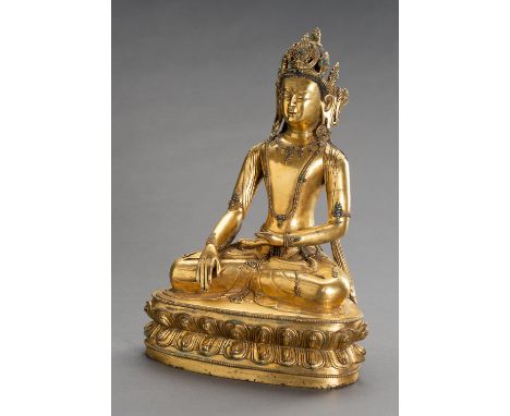 A LARGE GILT BRONZE FIGURE OF CROWNED BUDDHA SHAKYAMUNIChina, late Qing Dynasty (1644-1912). Shakyamuni is cast, seated in dh