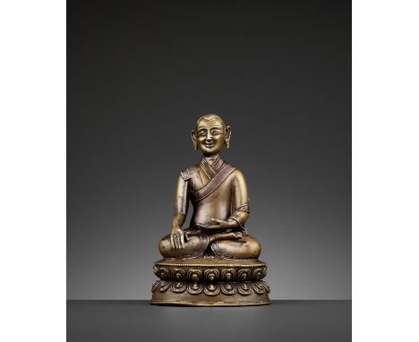 A PORTRAIT BRONZE OF A MONK, COPPER- AND SILVER-INLAID, 16TH-18TH CENTURYTibet. Cast seated in dhyanasana on a sealed double-