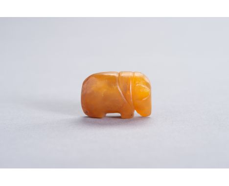 A SMALL PYU HONEY-AGATE 'ELEPHANT' TALISMANBurma/ Myanmar, Pyu city states (200-1000 CE). Well-polished agate of a nice warm 