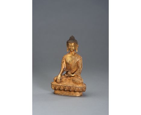 A GILT BRONZE BUDDHAChina, 20th century. Cast seated in dhyanasana on sealed lotus base, the right hand lowered in bhumispars