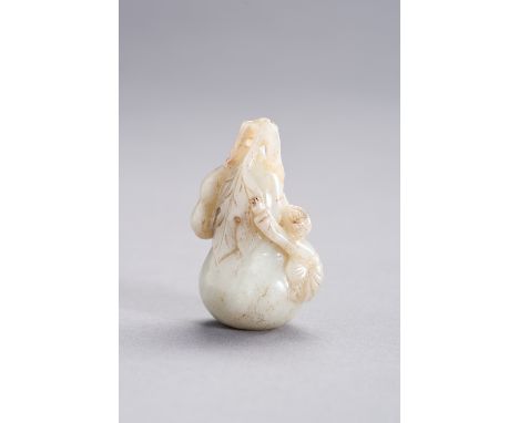 A CELADON JADE PENDANT DEPICTING A BOY CLIMBING A GIANT DOUBLE GOURD, LATE QING TO REPUBLICChina, late Qing dynasty (1644-191