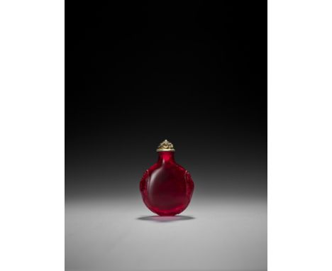 A TRANSPARENT RUBY RED GLASS SNUFF BOTTLE, QING DYNASTYChina, 18th-19th century. The circular bottle with a tapering neck and