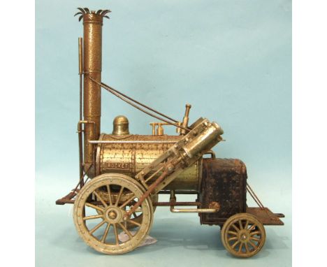 A model of Stephenson's Rocket, of cast metal and tinplate construction, (some surface corrosion), 22cm long. 