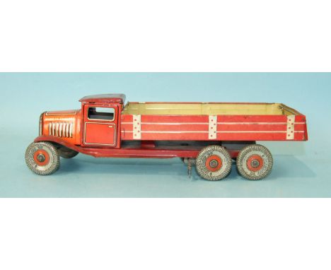 A Mettoy tinplate c/w six-wheel tipper, red and cream, with 'Dunlop 90' balloon tyres, 32cm long. 