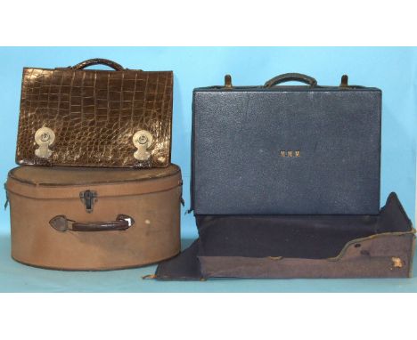 A good-quality crocodile attaché case stamped San Kong Leather Trunk Co, Singapore, a blue leather suitcase with canvas cover