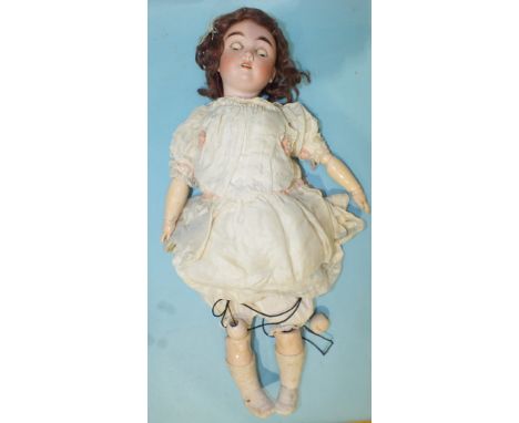 A Max Handwerck child doll with sleeping brown eyes, brown mohair wig and jointed composition body, in silk dress with cotton