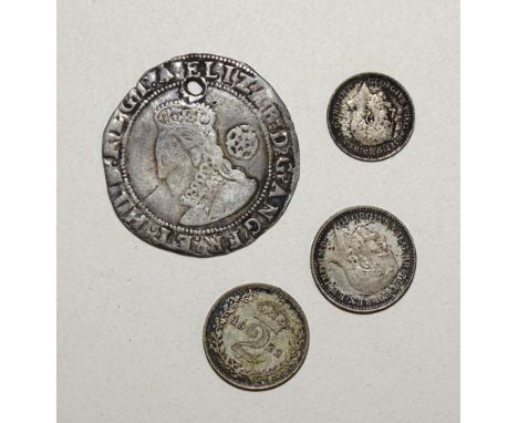 An Elizabeth I 1583 hammered-silver sixpence, (holed), two George V 1922 Maundy two-pence and one penny, together with a smal