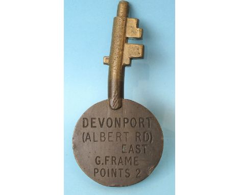 An Annetts bronze key stamped Devonport (Albert Rd) East, G. Frame, Points 2 on one side, 14cm long. 