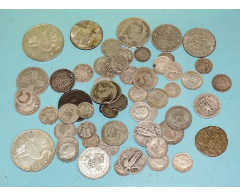 A quantity of British and World coinage, including a small collection of pre-1947 silver. 