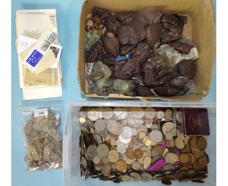 A large collection of British coinage, including £9 in pre-1947 silver and a small quantity of stamps. 