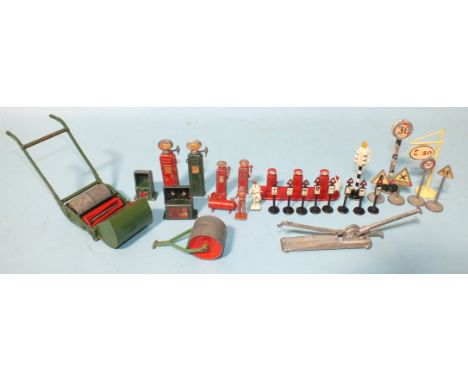 Dinky, 751 Lawn Mower, 105A Garden Roller, petrol pumps, air pumps, road signs and a Fairylite Auto Jack, (all play-worn) and