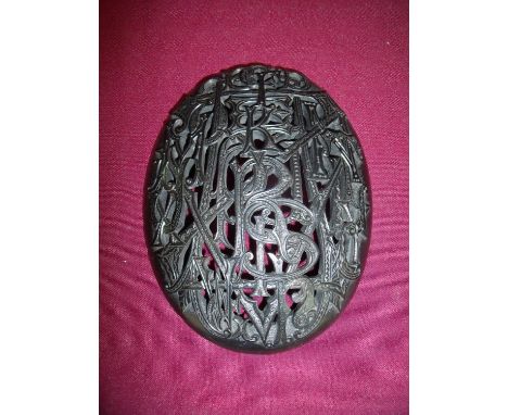 Large Victorian carved convex oval Whitby Jet book cover panel depicting all letters of the alphabet interwoven in Gothic scr