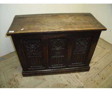 Oak storage box with lift up rectangular top with triple carved panel detail to the front (83.5cm x 36cm x 62.5cm) 