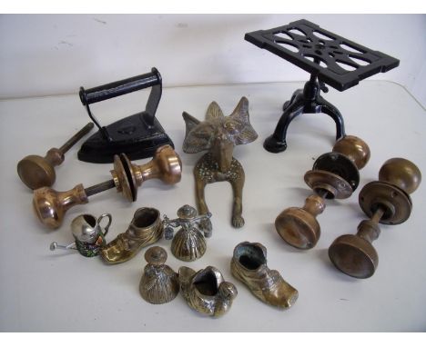 Selection of various brass door handles, adjustable height iron trivet and flat iron, various brass ornaments and a fox door 