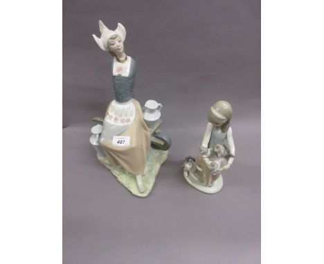 Lladro porcelain figure of a seated Dutch girl together with another, girl with cats