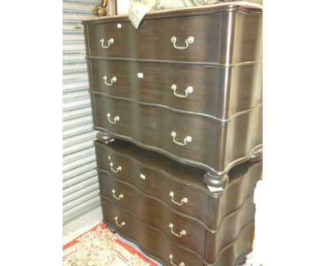 Pair of good quality modern ebonised three drawer shaped front commode chestS with swan neck handles raised on low bun feet