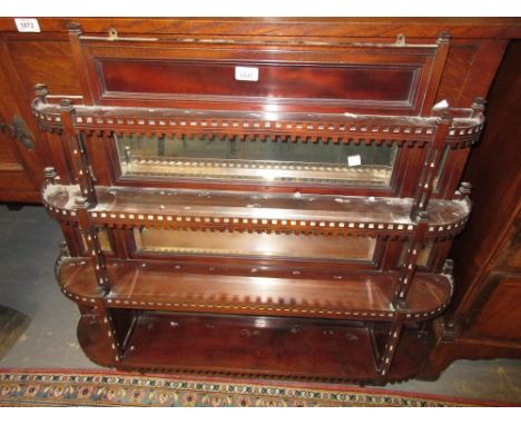 Victorian mahogany four shelf wall bracket with bevelled glass inserts and fretwork decoration